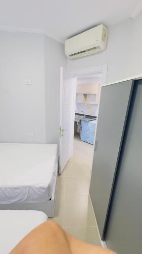 a small room with two beds and a heater at Porto Matrouh Unique Chalet 81003 in Marsa Matruh
