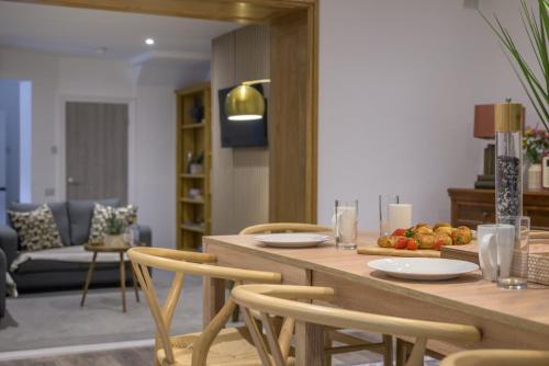 a dining room with a table with chairs and a tableasteryasteryasteryasteryastery at Moss Crag in Penrith