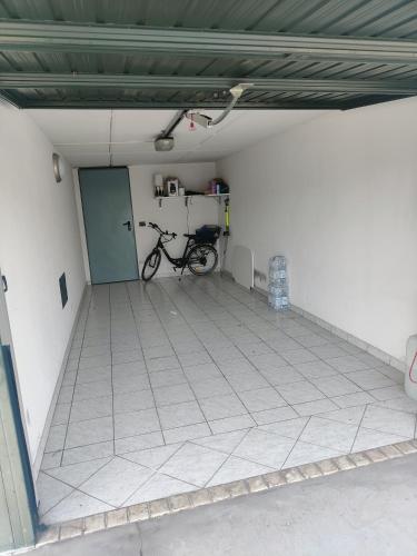 a garage with a bike parked in a room at Da Angela in Azzano Decimo