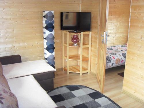 Posteľ alebo postele v izbe v ubytovaní Domki Letniskowe Marzena