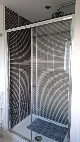 a large window with blinds on it in a bathroom at Tradewinds Integrated Services Ltd in Peterborough