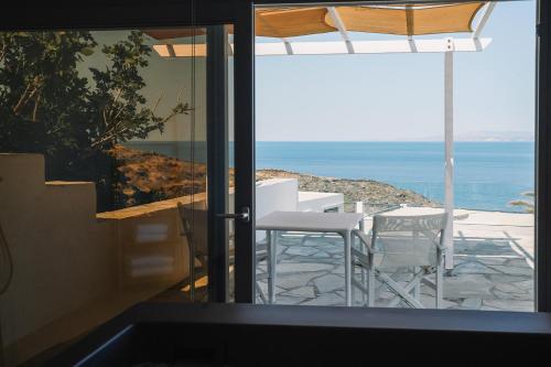 a view of the ocean from the balcony of a house at Cape Napos in Faros