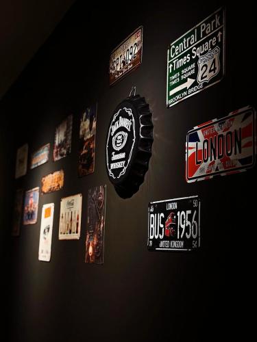a wall with a bunch of stickers on it at Chill out Zone , villa with 4 bedrooms, whole apartment, апартамент целиком in Dilijan