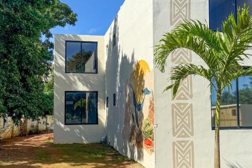 a building with a painting on the side of it at Villavida Boutique Hotel - La Playita in Las Galeras