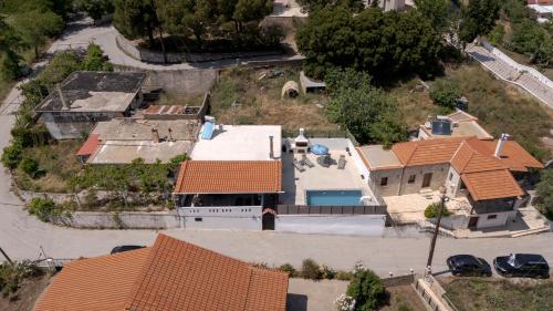 an overhead view of a house with orange roofs at Villa Foteini Gerakari Mountain Resort in Yerakárion