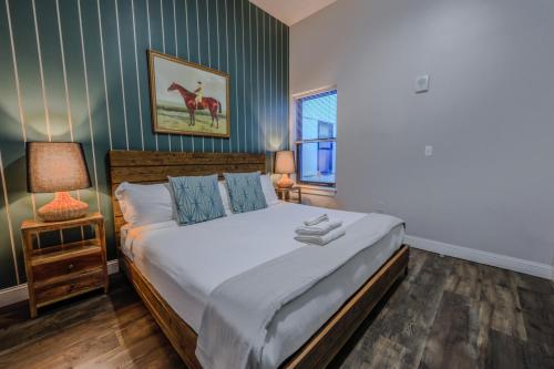 a bedroom with a bed and a picture of a giraffe at 4 Bed 2 Bath 200mbps Internet Luxury Keyless Entry in Boston