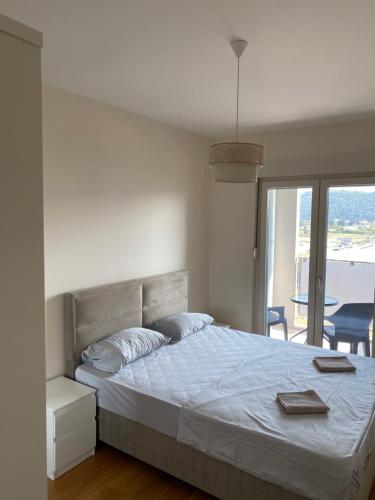 En eller flere senge i et værelse på Oaza Bar