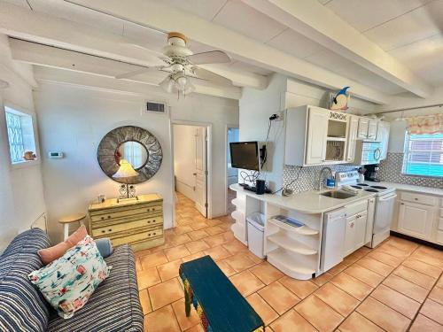 a living room with a couch and a kitchen at Miami-2BR-Across from Beach in St. George Island