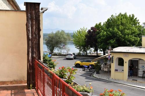 a balcony with a view of a street and a parking lot at Ninfa Del Lago Bedrooms by Dinamica Real Estate in Posta Fibreno