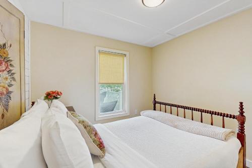 a bedroom with two beds and a window at Bliss on the Bluff in Crosby