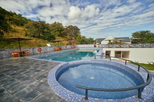 a large swimming pool in a yard at Tarangire Luxury Hideaway in Mbesi