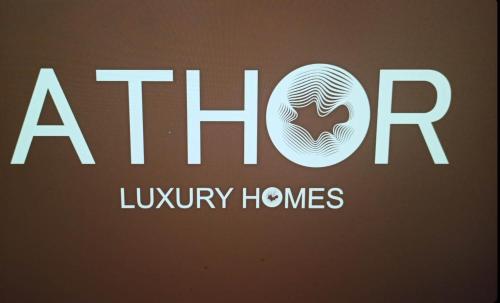 a logo for aldrin luxury homes is shown at ATHOR IREON with hot tube in Iraion
