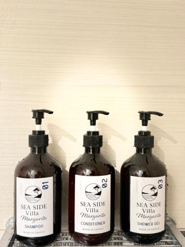 a group of three bottles of skin glue on a counter at Seaside Villa Margarita in Akrotiri