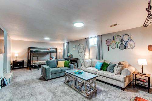a living room with a couch and a bed at Spacious family home in Littleton with fenced yard in Littleton