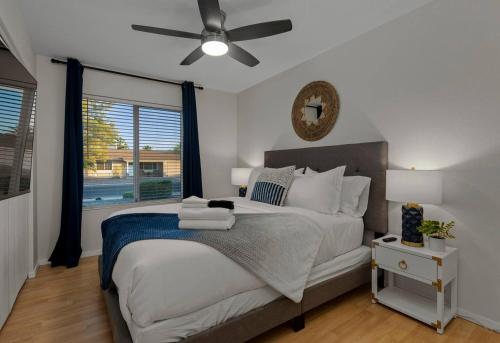 a bedroom with a bed and a ceiling fan at Tranquility 4 Bedroom With Free Heated Pool! in Mesa