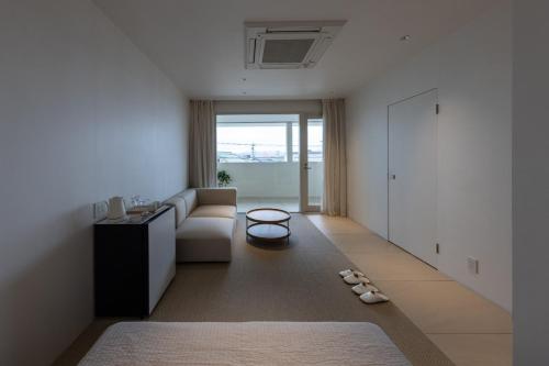 a living room with a couch and a table at noma - Vacation STAY 21501v in Gifu