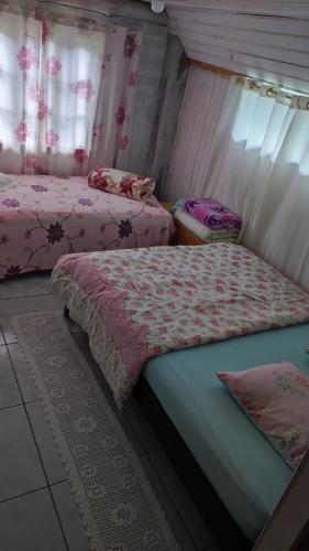 Postel nebo postele na pokoji v ubytování Cantinho do Sossego