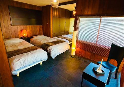 Ένα ή περισσότερα κρεβάτια σε δωμάτιο στο Shiki-Oriori - Vacation STAY 09649v