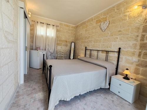 Ένα ή περισσότερα κρεβάτια σε δωμάτιο στο Masseria Don Egidio