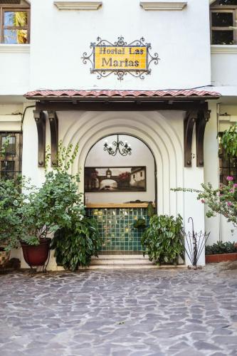 a store front of a building with a sign on it at Hotel Las Marías in Taxisco
