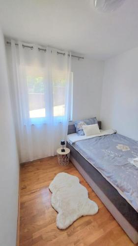 Katil atau katil-katil dalam bilik di Apartment Tina