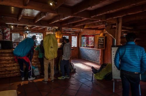 people standing around in a room at Calafate Hostel in El Calafate