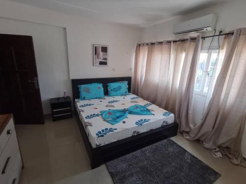 Llit o llits en una habitació de Appartement meublé