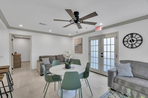 a living room with a couch and a table and chairs at Sleeps 24-spacious Suites Near Fq W Pool in New Orleans