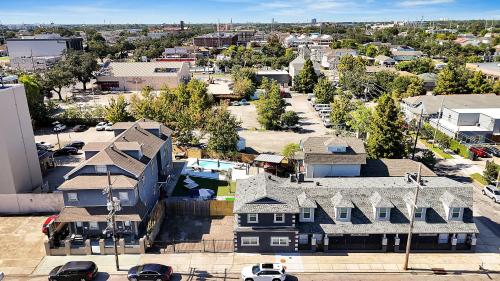an aerial view of a small town with houses at Sleeps 24-spacious Suites Near Fq W Pool in New Orleans