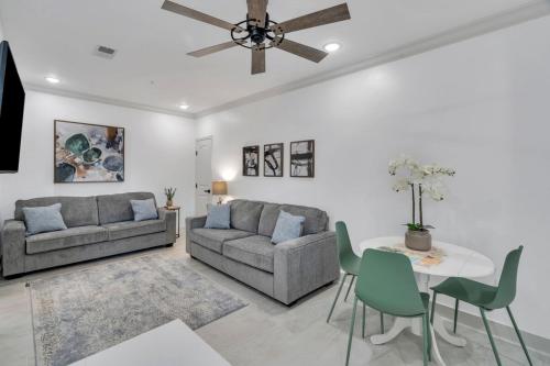 a living room with a couch and a table at Sleeps 24-spacious Suites Near Fq W Pool in New Orleans