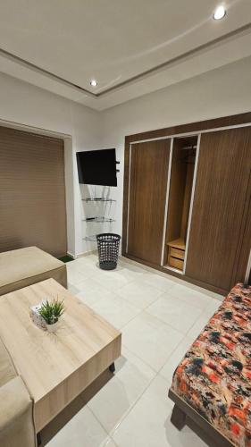 a living room with a couch and a coffee table at Bright and Cosy appartment in Oulad Yakoub