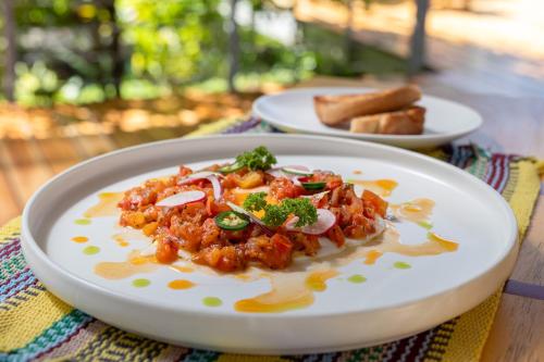 a plate of food sitting on a table at Cielo Lodge in Golfito
