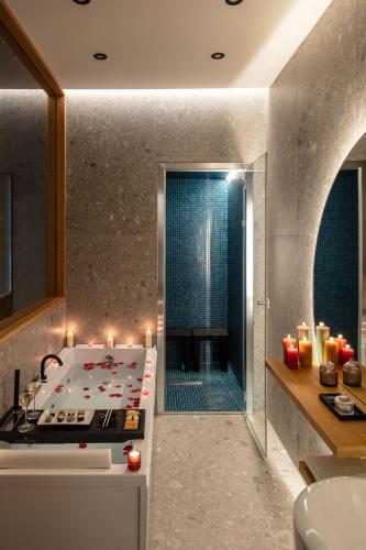 a kitchen with a stove and a sink with candles at Fortunella Suites Luxury in Portici