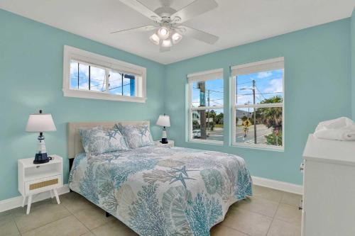 a bedroom with a bed and a ceiling fan at Oceanview on Tybee 202-3 in Tybee Island