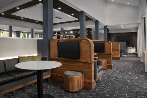 a waiting room with a row of televisions at Courtyard Spokane Downtown at the Convention Center in Spokane