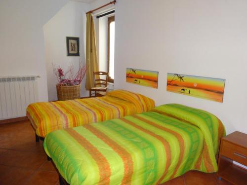 En eller flere senge i et værelse på Hysnara Affittacamere