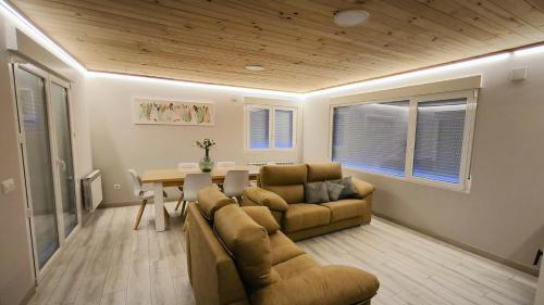 a living room with a couch and a table at Torreón El Guindal - Sierra de Gredos in Mijares