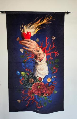 a painting of a hand holding a heart at Boutique Studio City Views, Patio, Fireplace Voglio Bene in Calgary
