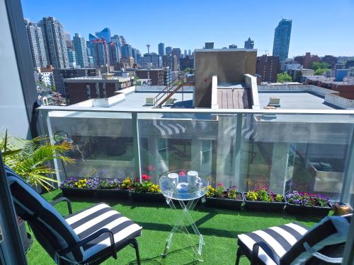 a balcony with a view of a city at Boutique Studio City Views, Patio, Fireplace Voglio Bene in Calgary