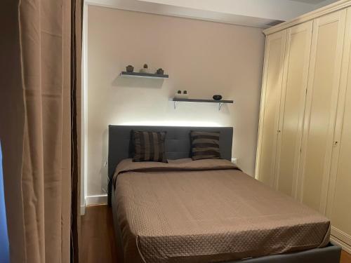 a small bedroom with a bed in a room at Home Dreams in Cosenza