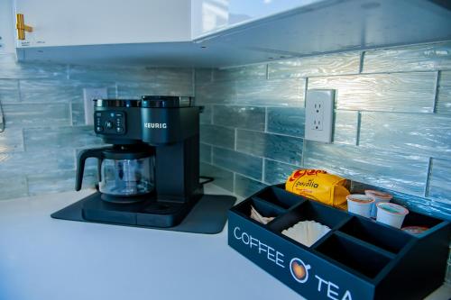 a kitchen with a coffee maker and a box on the counter at Family Tides in Destin