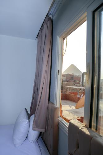 Cama o camas de una habitación en AMADEOS pyramids inn