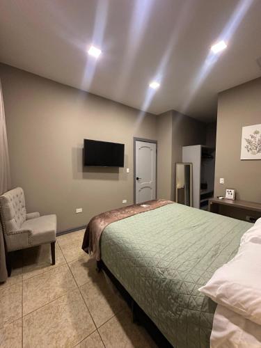 Ένα ή περισσότερα κρεβάτια σε δωμάτιο στο Tata's Apartment, Confortable y con Piscina