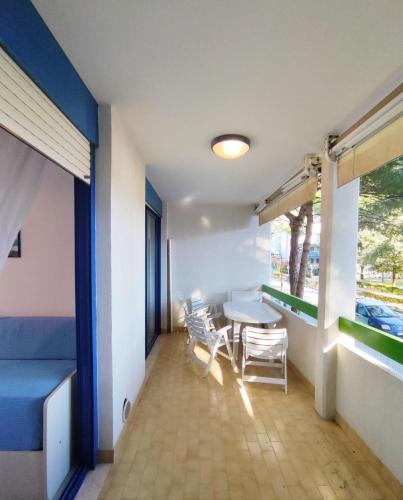 a room with a table and chairs and a window at Apartment in San Michele al Tagliamento 45664 in San Michele al Tagliamento