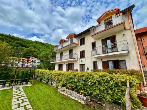 a large building with a lawn in front of it at La Villa Carmelina in Agerola