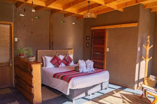 Postel nebo postele na pokoji v ubytování Origen del Maipo Lodge