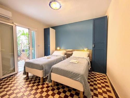 Postel nebo postele na pokoji v ubytování La Casina al Mare - Marina di Carrara