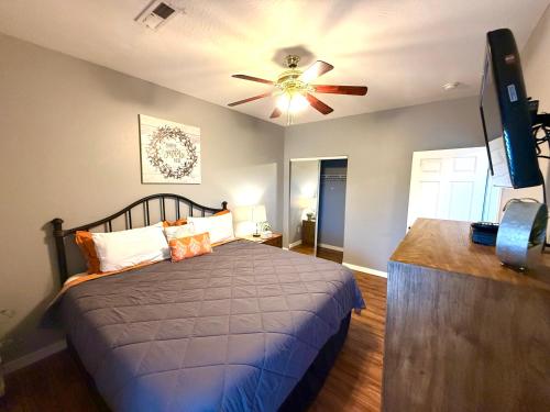a bedroom with a bed and a ceiling fan at Lakefront and Lake View Condo on Indian Point in Branson