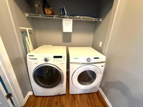 a laundry room with a washer and a dryer at Lakefront and Lake View Condo on Indian Point in Branson