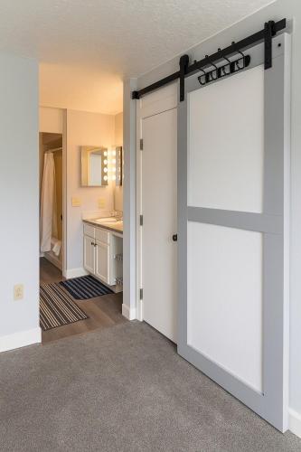 a sliding door in a room with a bathroom at Dillon Valley Mountain Escape in Dillon